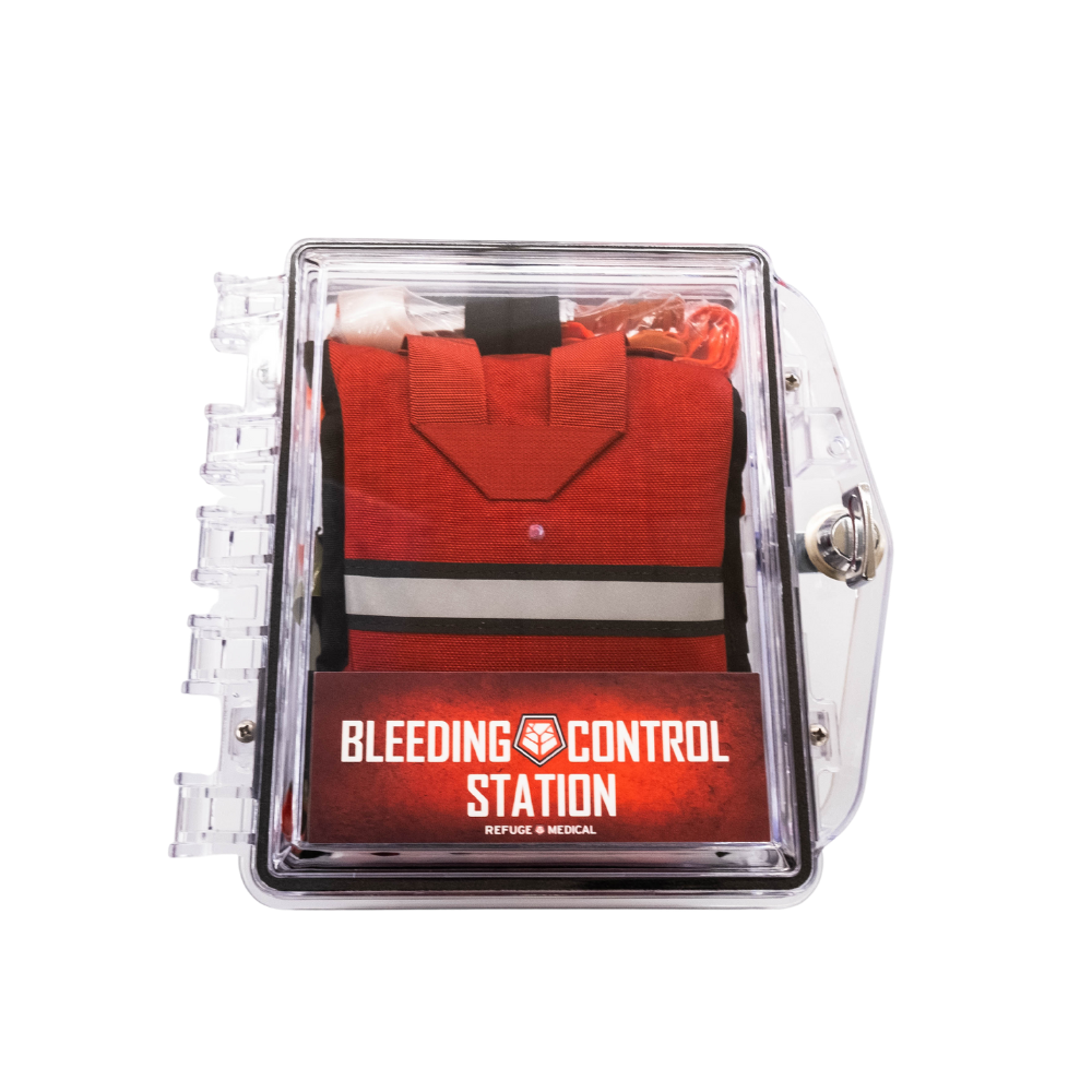 Refuge Medical Bleeding Control Station First Aid Kit - Red with reflective strip inside a clear plastic locking case (closed)