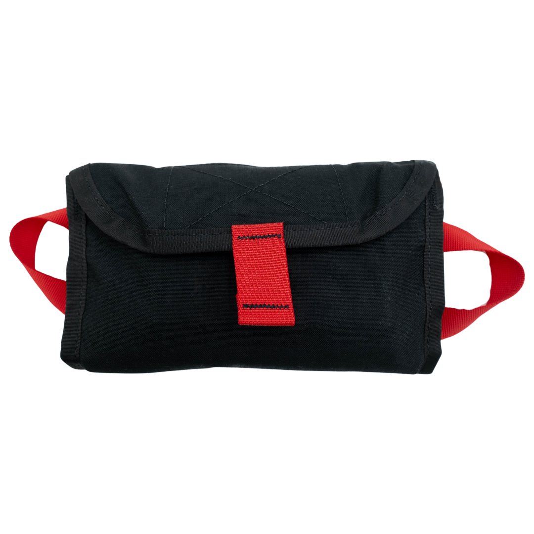 Refuge MedicalTravel FAK First Aid Kit - black inner pouch with red handles on both ends and a pull tab to open