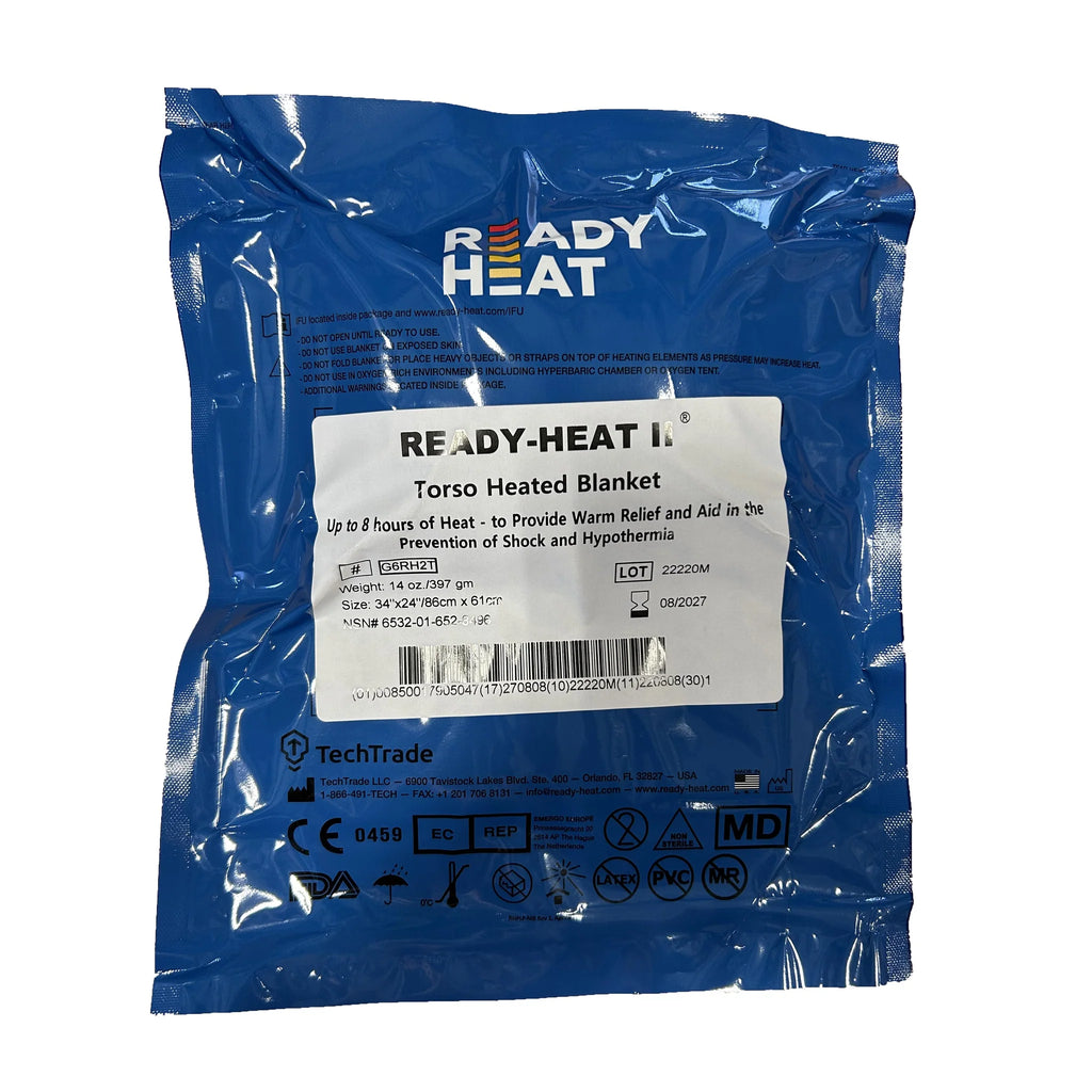 A packaged Ready Heat blanket in blue, sealed in plastic, with label information visible. Torso 34" x 24"