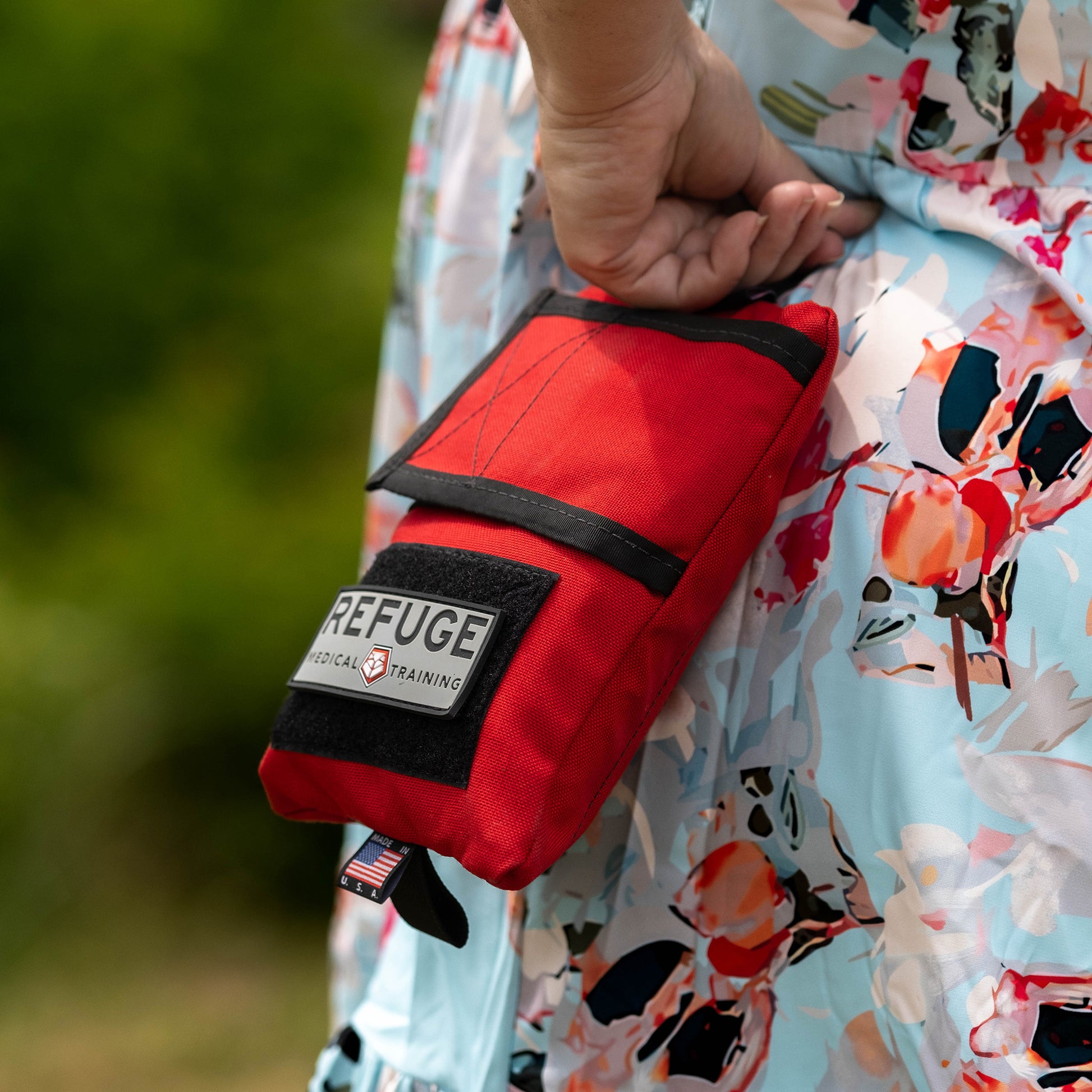 Refuge Medical Boo Boo First Aid Kit - Red, woman holding the Boo Boo kit