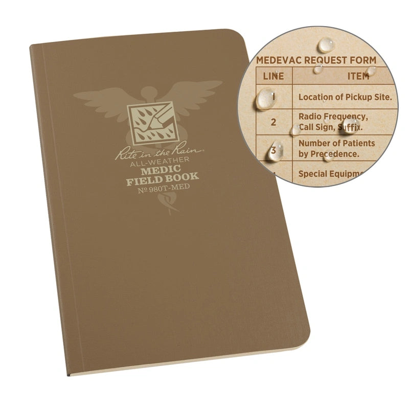 A brown, weatherproof notebook with a logo and text on the cover, titled 'MEDIC FIELD BOOK - RITE IN RAIN'. It shows an example of water drops on the paper